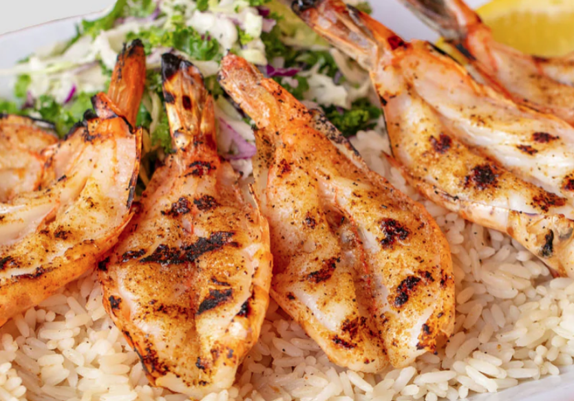 A plate of food with shrimp and rice.