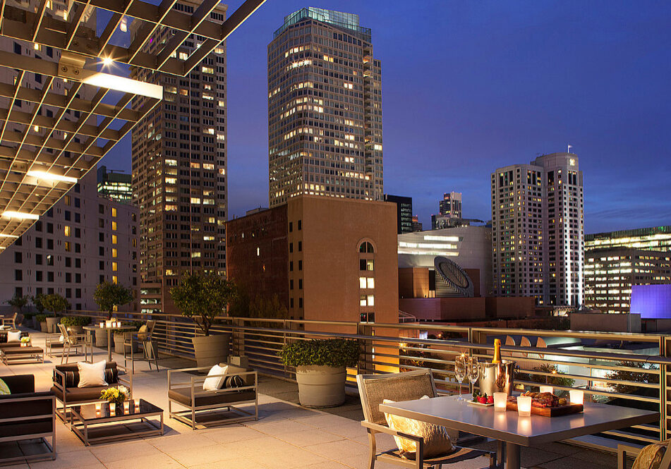 A view of some tables and chairs on the roof.