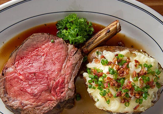 A plate of food with meat and vegetables on it.