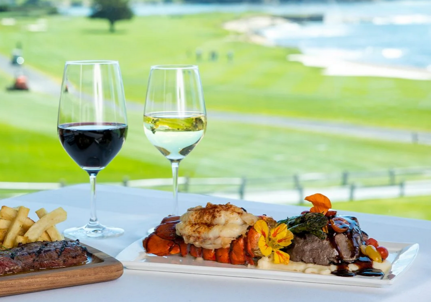 A plate of food and two glasses on the table.