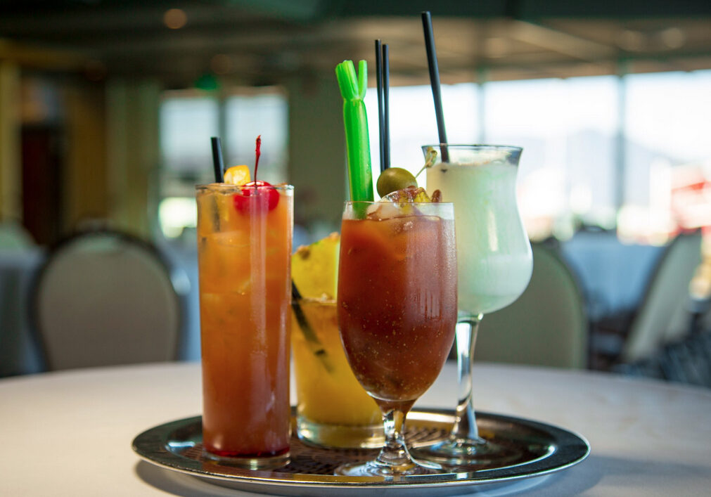 A tray with three different drinks on it.